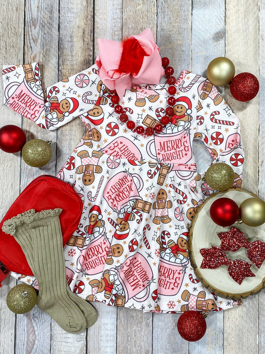 Hot cocoa girls dress on wooden background with ornaments and accessories