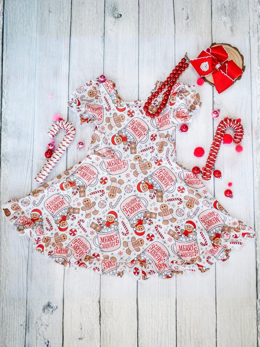 Christmas-themed apron with gingerbread design on a wooden surface