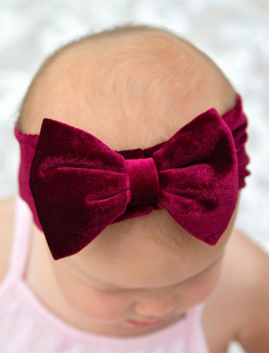 Velvet bow headband in wine on model