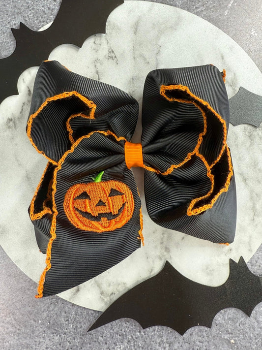 Jack-o-lantern embroidered moonstitch hair bow on alligator clip