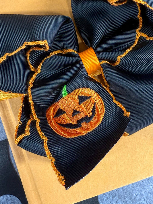 close up of the jack-o-latern emboirdery - Alternative view