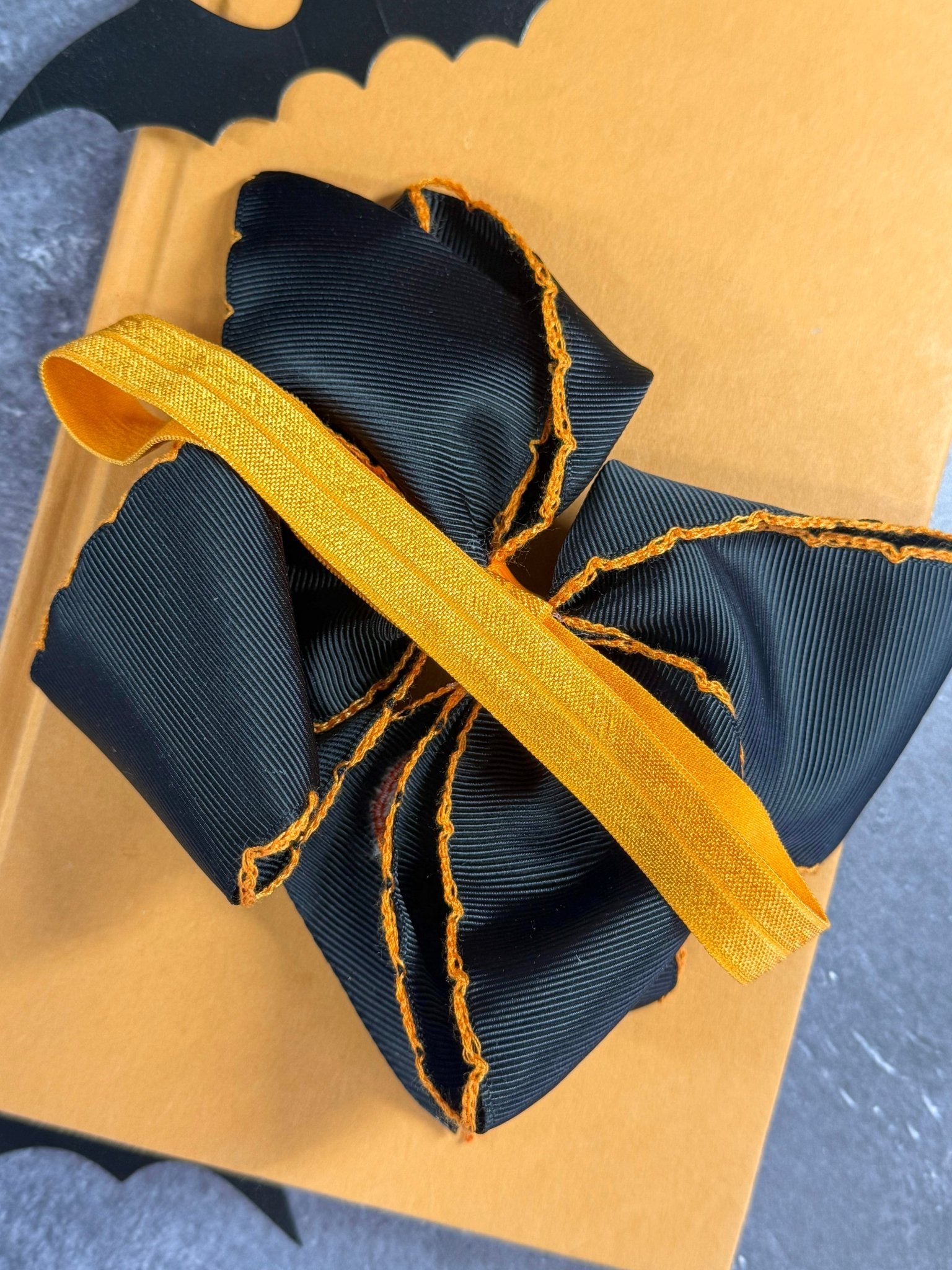 back of the headband showing the elastic satin band