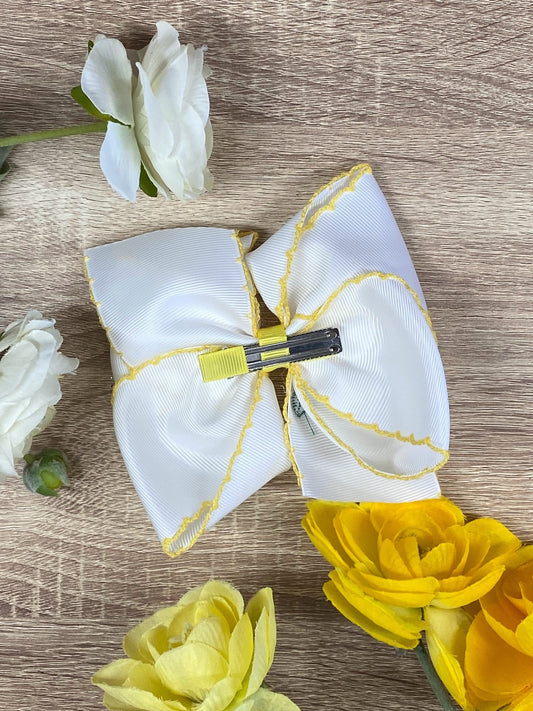 Back of lemon embroidered moonstitch hair bow showing alligator clip - Alternative view