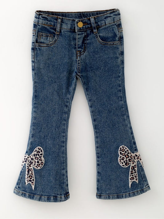 Girls blue denim bell bottom jeans with leopard print bow appliqués