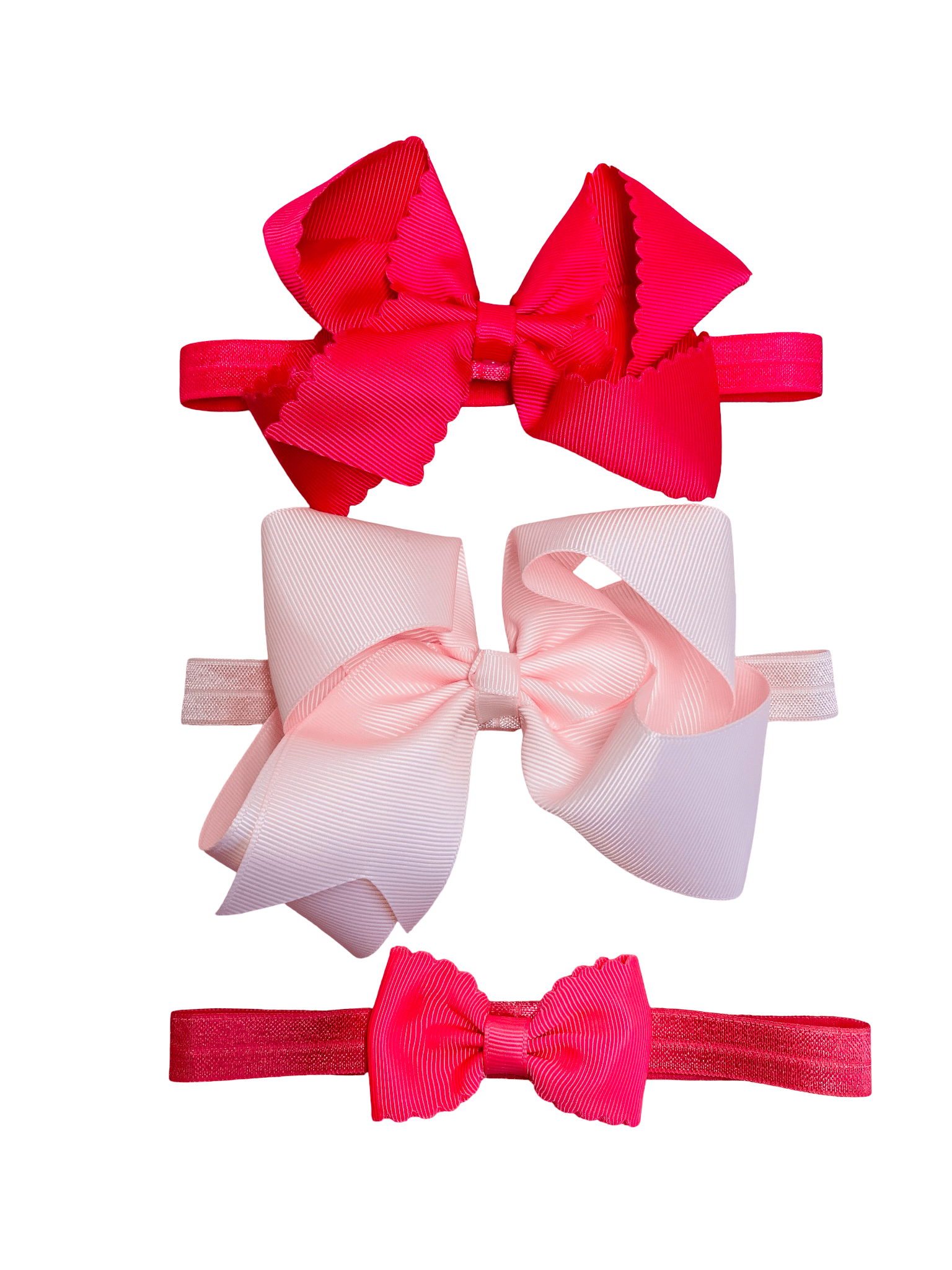 Three colorful hair bows on white background