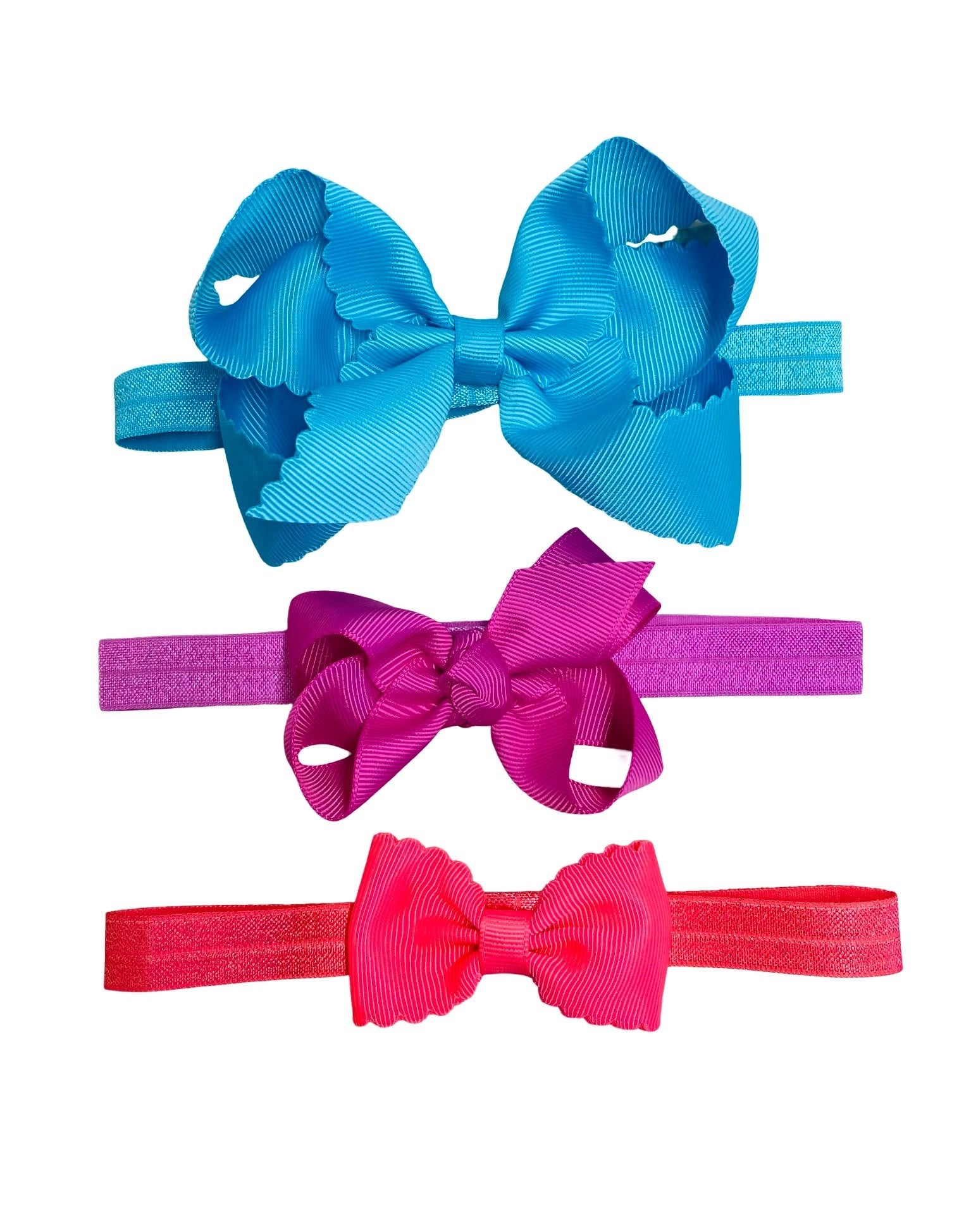 Three colorful hair bows in blue, pink, and red on a white background