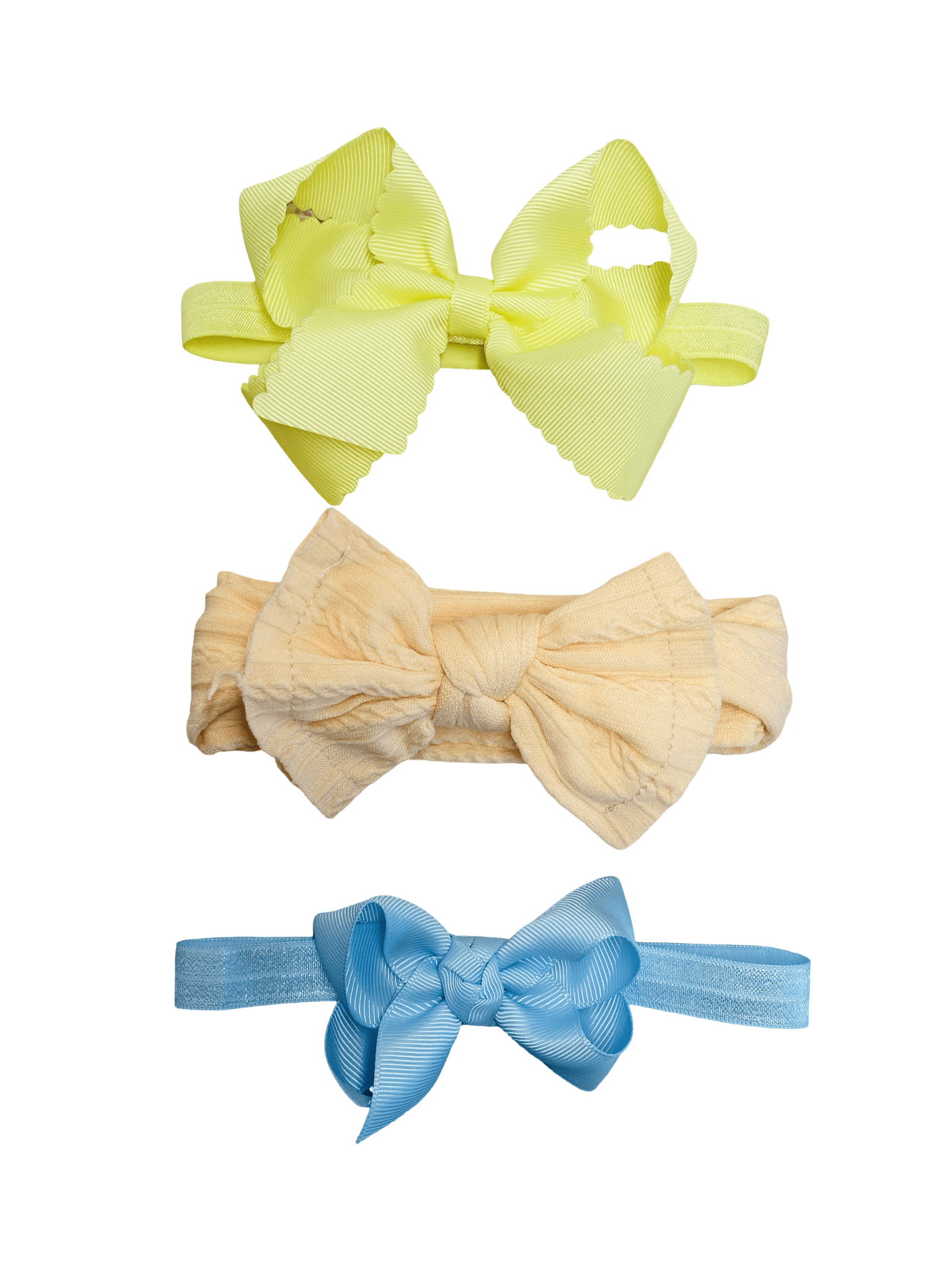 Three colorful hair bows on a white background