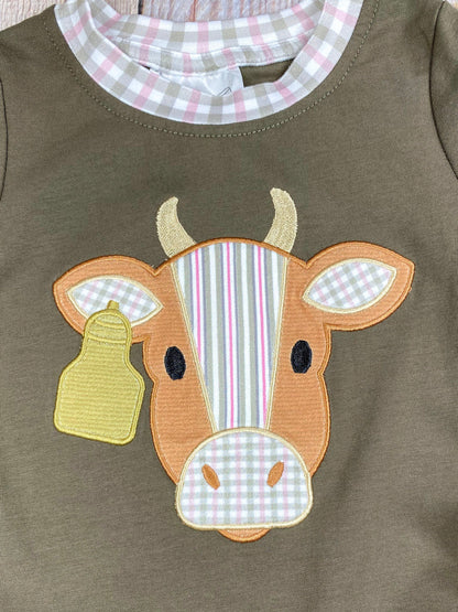 boys western long sleeve top with cow appliqué and faux gingham layered sleeve accents on a wooden background