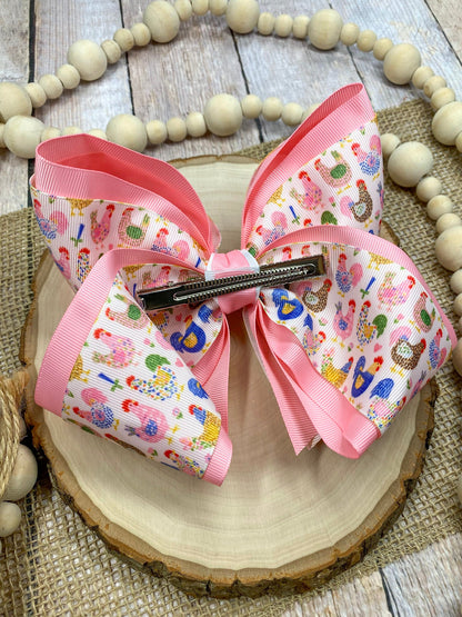 Little Chicken Patch Print Double Layer Hair Bow on a wooden surface