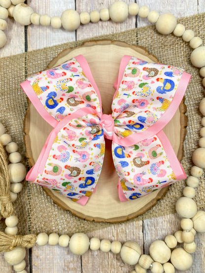 Little Chicken Patch Print Double Layer Hair Bow on a wooden surface