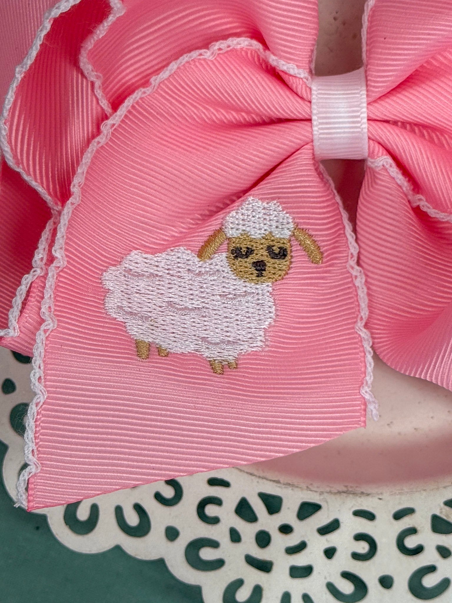 embroidered lamb on pink ribbon