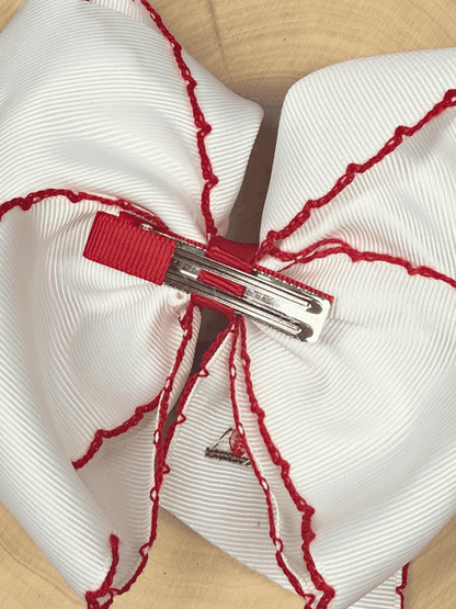 Back of Little Red Farmhouse Barn hair bow with alligator clip attachment