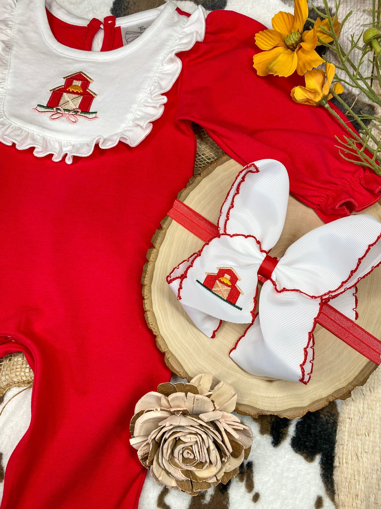 baby girl fall one-piece with barn appliqué ruffle bib and patchwork ruffle leg hems