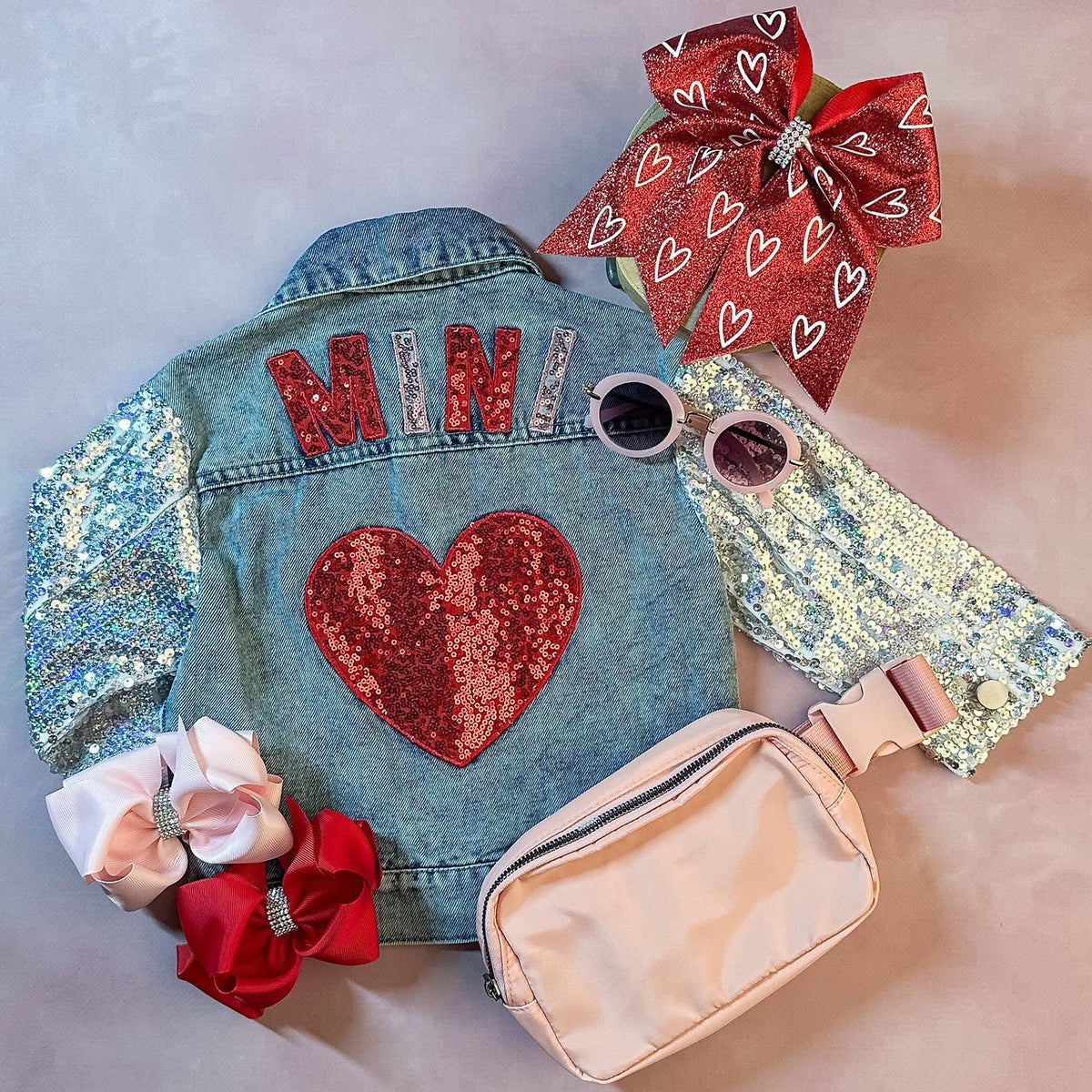 Mini jean jacket with heart patches and sequin sleeves