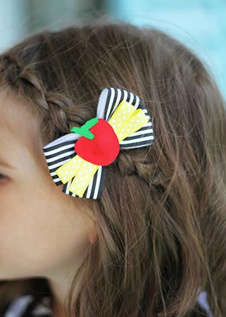 Red, Yellow, Black & White Teacher's Favorite Apple Bow Clippie On Model