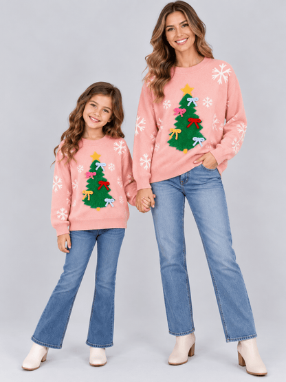 Pink mom and me Christmas sweater with fuzzy tree, colorful bows and white snowflakes