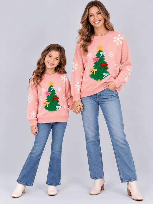 Pink mom and me Christmas sweater with fuzzy tree, colorful bows and white snowflakes