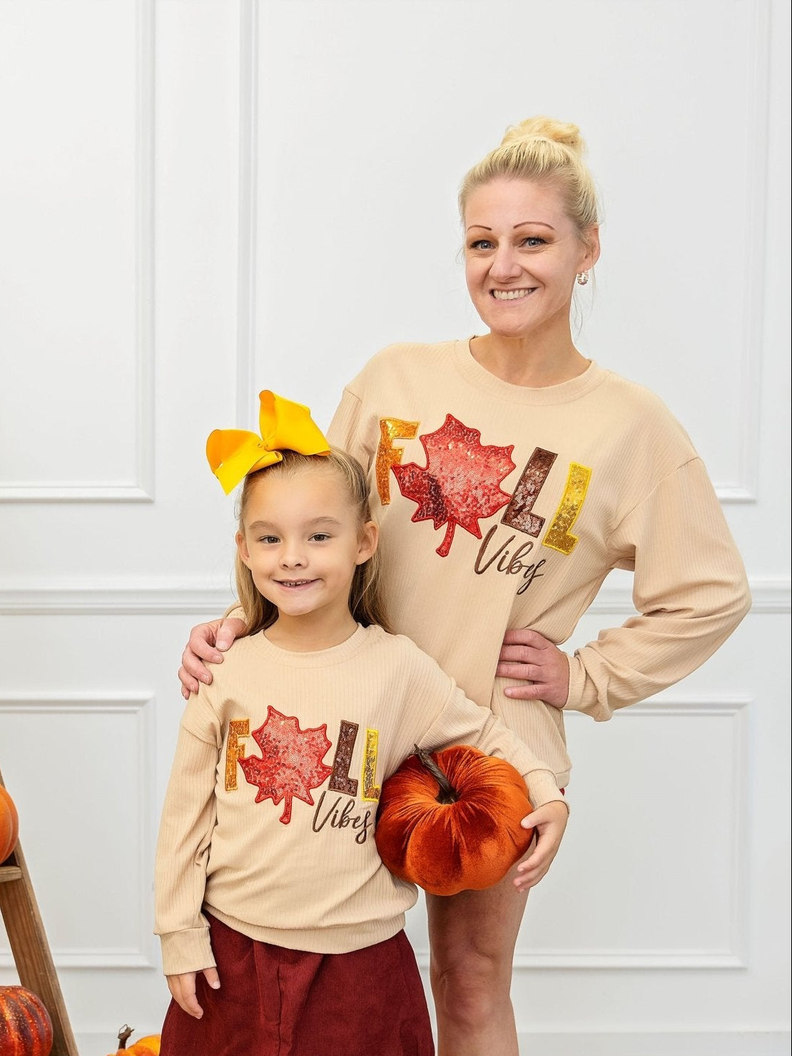 Mom and daughter wearing matching fall vibes shirts