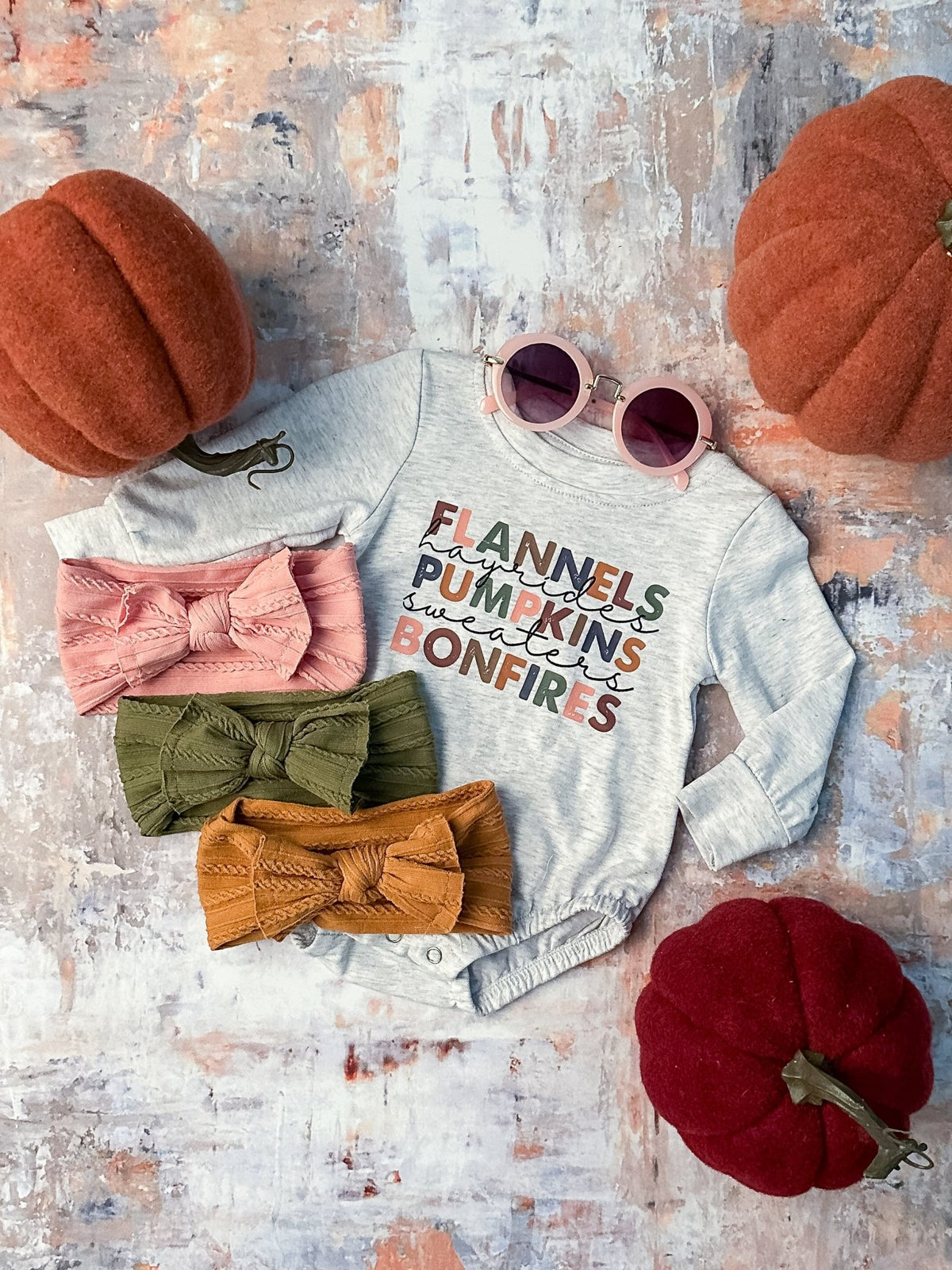 Baby onesie with the flannels, hayrides, pumpkins list
