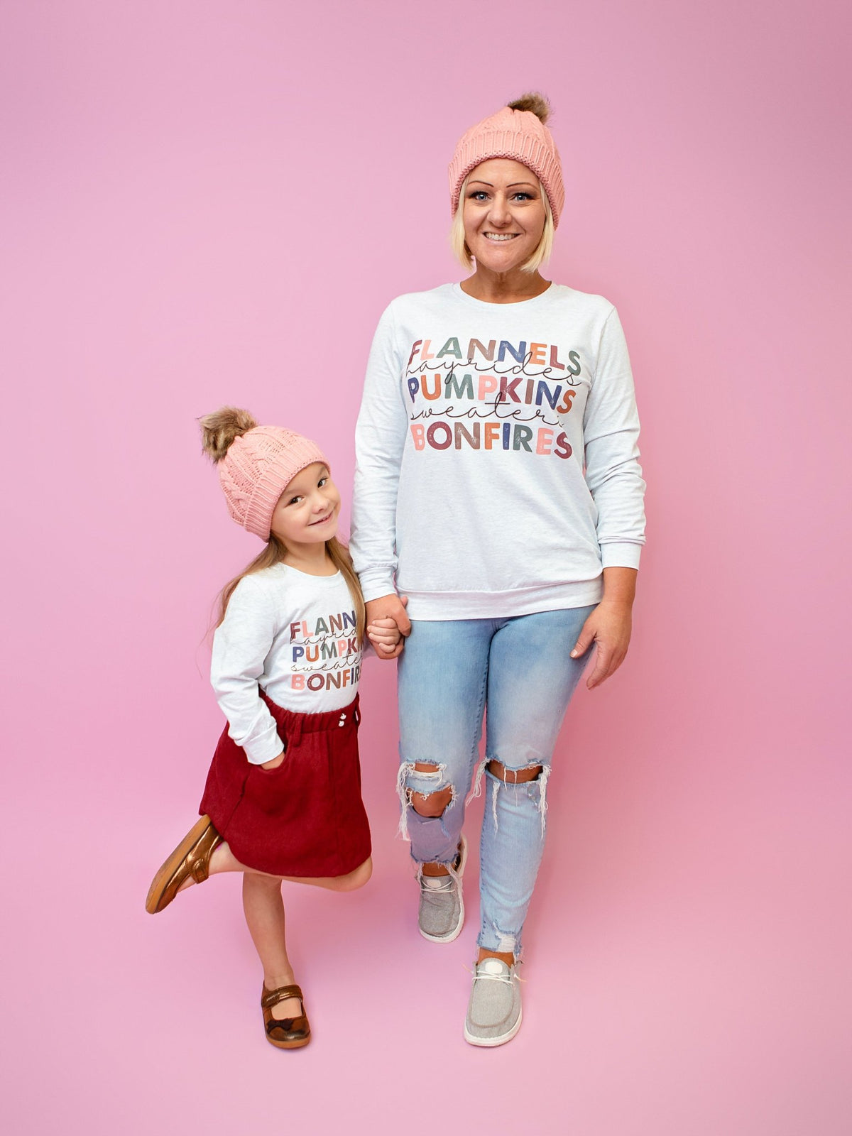 Mom and daughter wearing the flannels and bonfires shirts