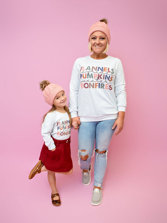 Mom and daughter wearing the flannels and bonfires shirts