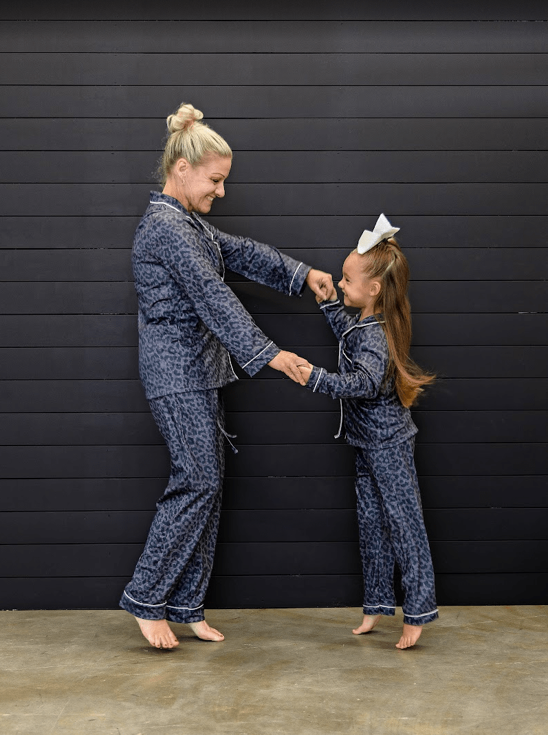 Woman & girl models wearing the Black Animal Print PJ's