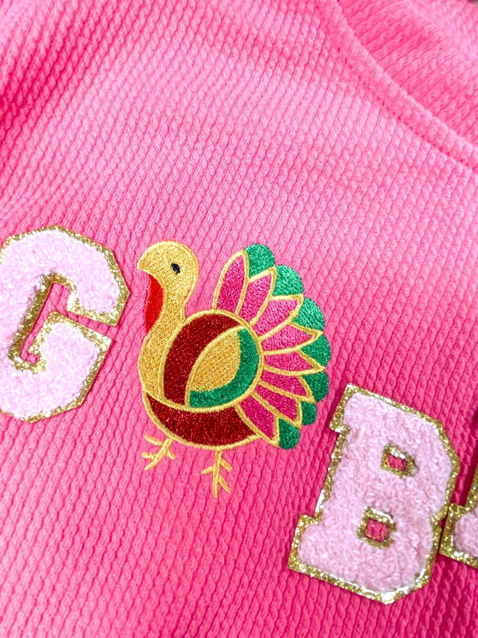 close up of the colorful turkey as the "o" in gobble