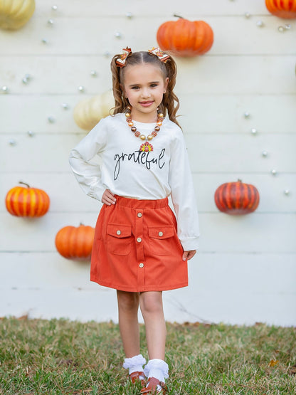 Girl wearing the Grateful sweatshirt
