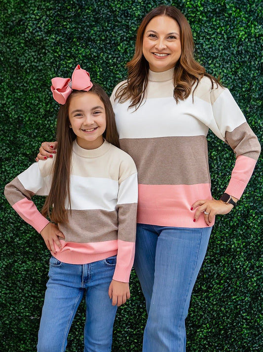 Pink, cream and tan colorblock sweater on a model
