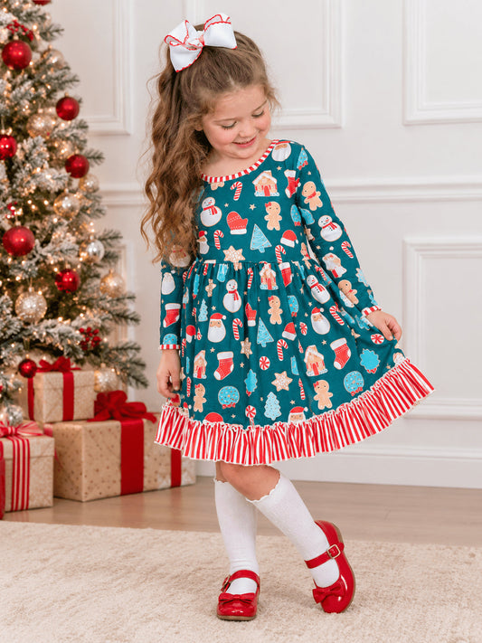 Girl wearing a teal Christmas twirl dress with Santa and gingerbread print