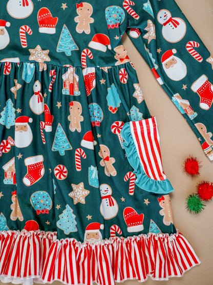 Children's outfit with Christmas-themed pattern on a teal background