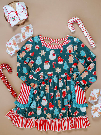 Children's Christmas-themed dress with ruffles and candy cane accessories on a beige background
