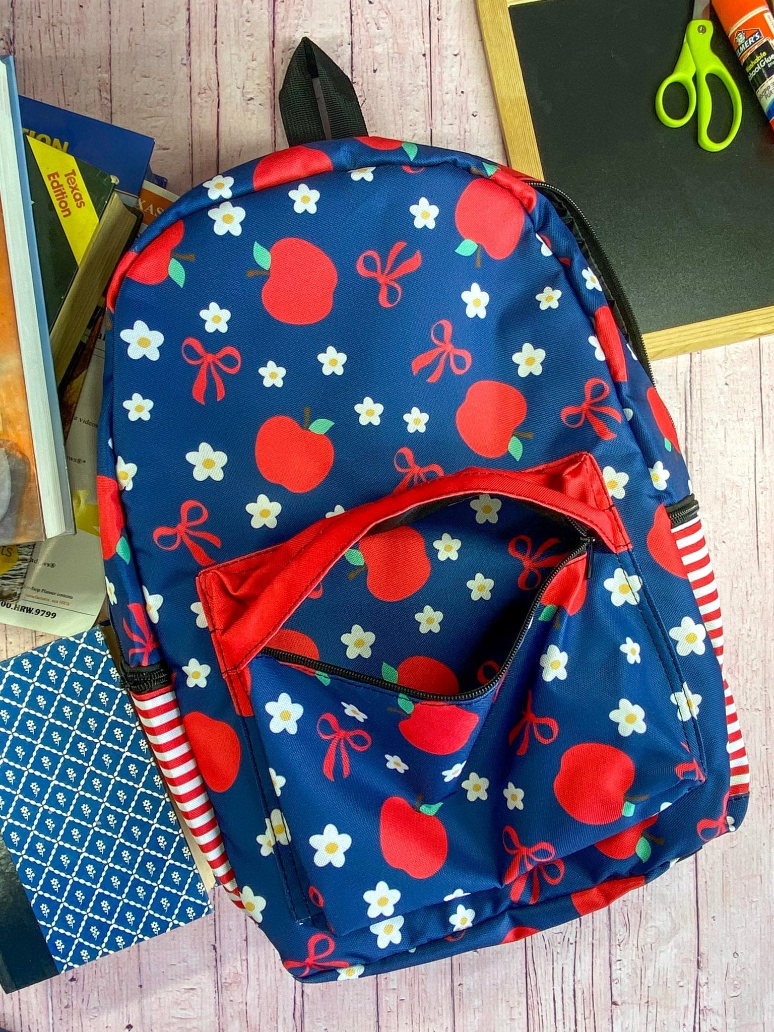 front of the Navy & Red Apples Backpack