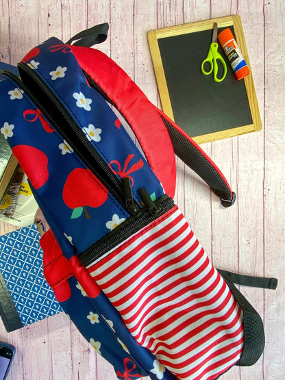 side of the Navy & Red Apples Backpack