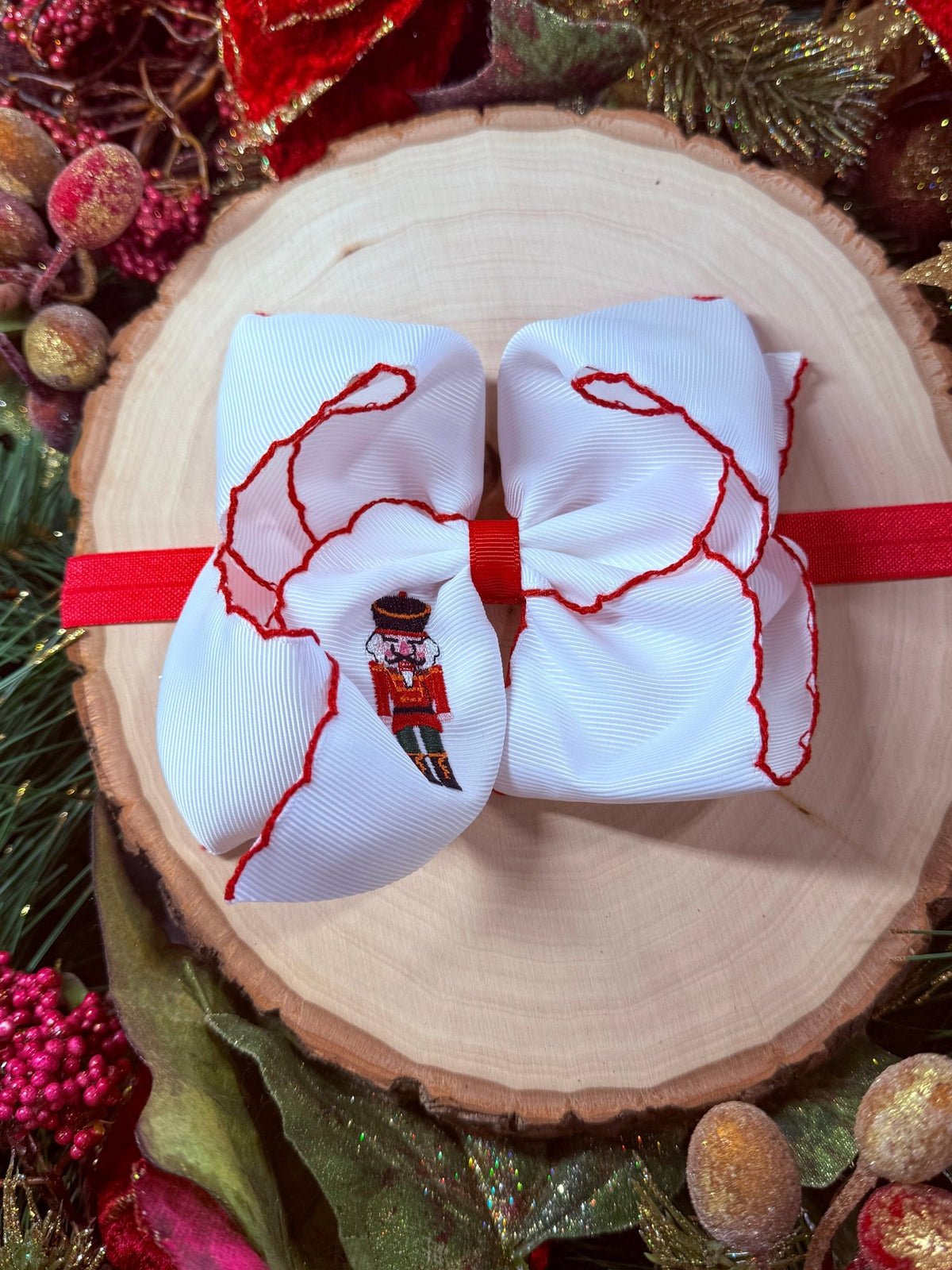 Nutcracker embroidered moonstitch bow on satin headband