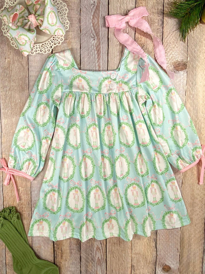 Children's dress with nutcracker pattern on a wooden surface