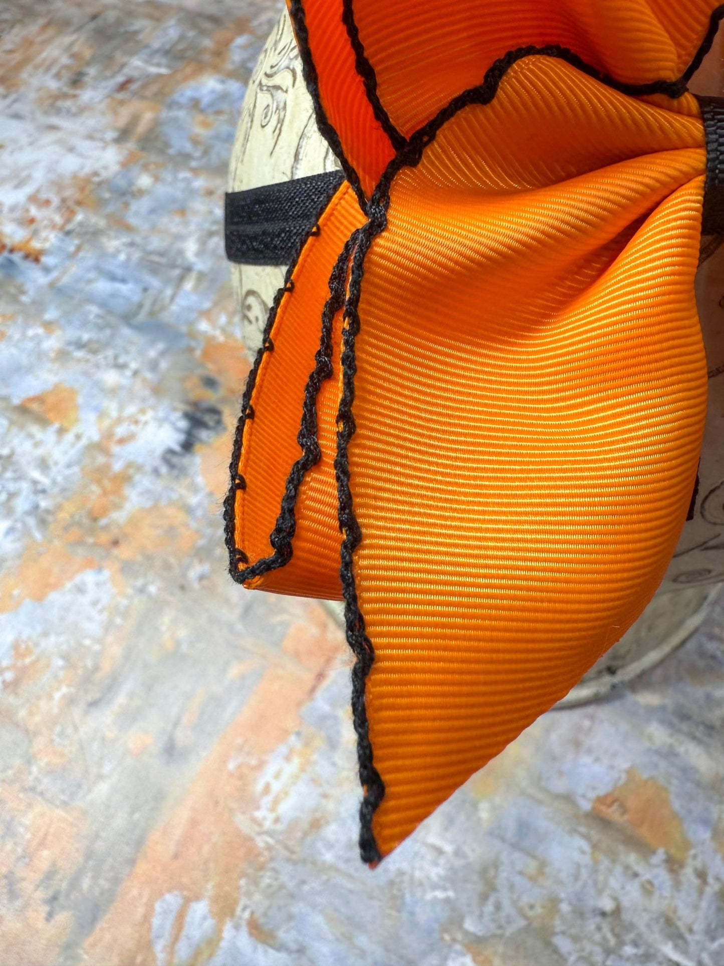 close up of bow showin moonstitch details