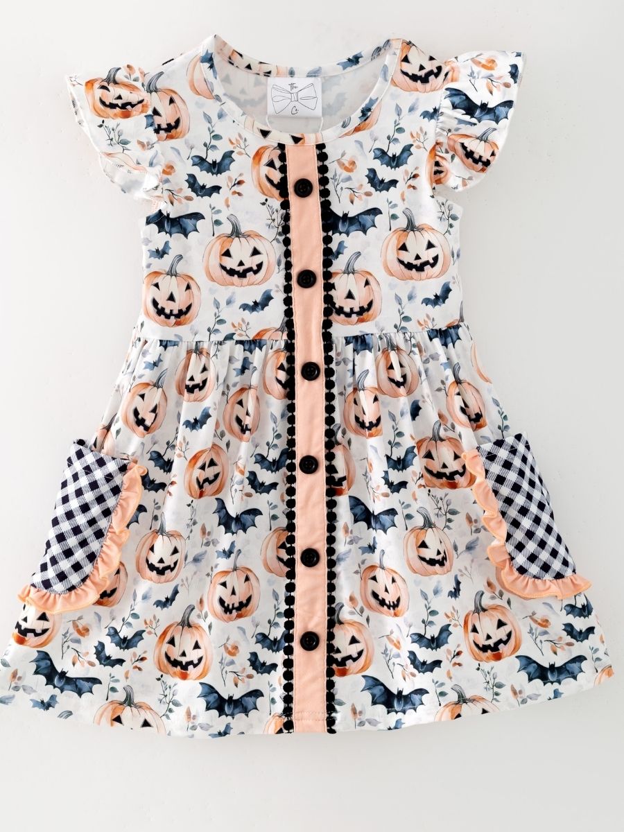girls Halloween dress with jack-o-lantern bat print and check ruffle pockets