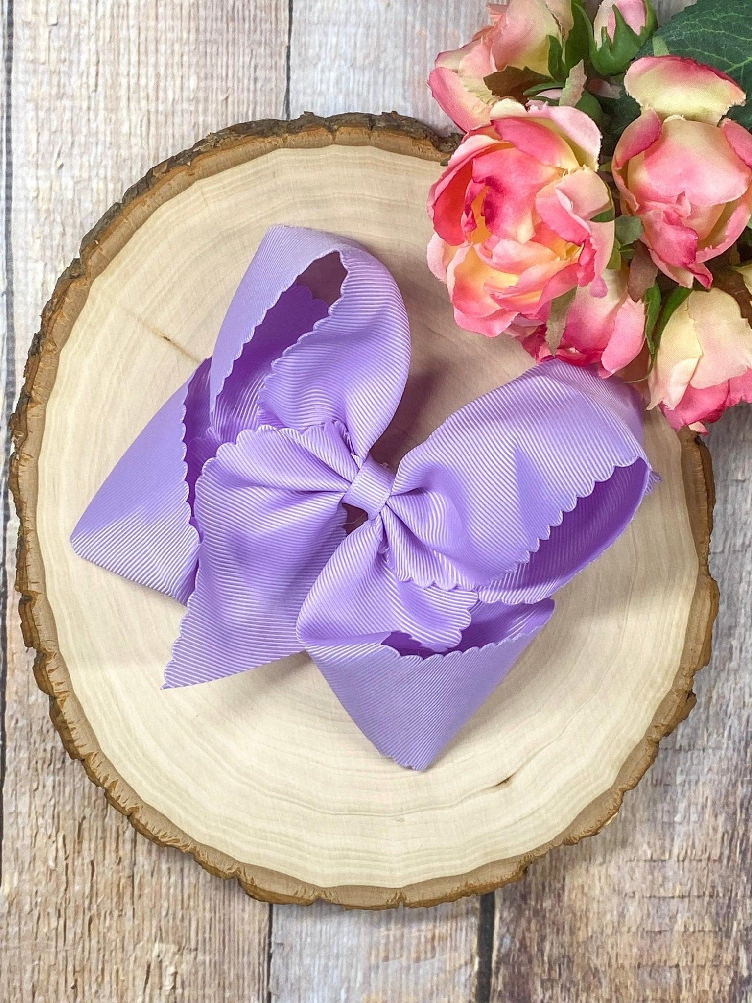 lavender hair bow on wooden display