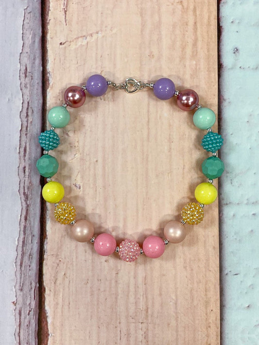 Chunky bead necklace in soft pastel rainbow colors and rainbow pastel rhinestone beads and rainbow pearls with heart clasp. - Alternative view