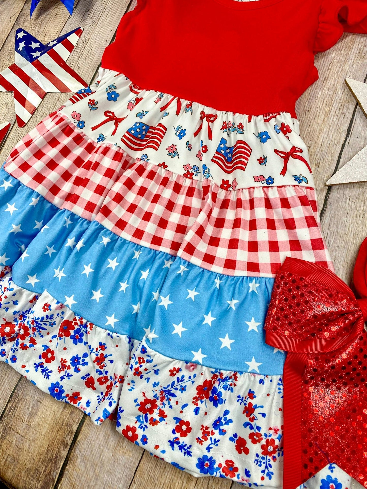 Patchwork Twirl Dress on a wooden background