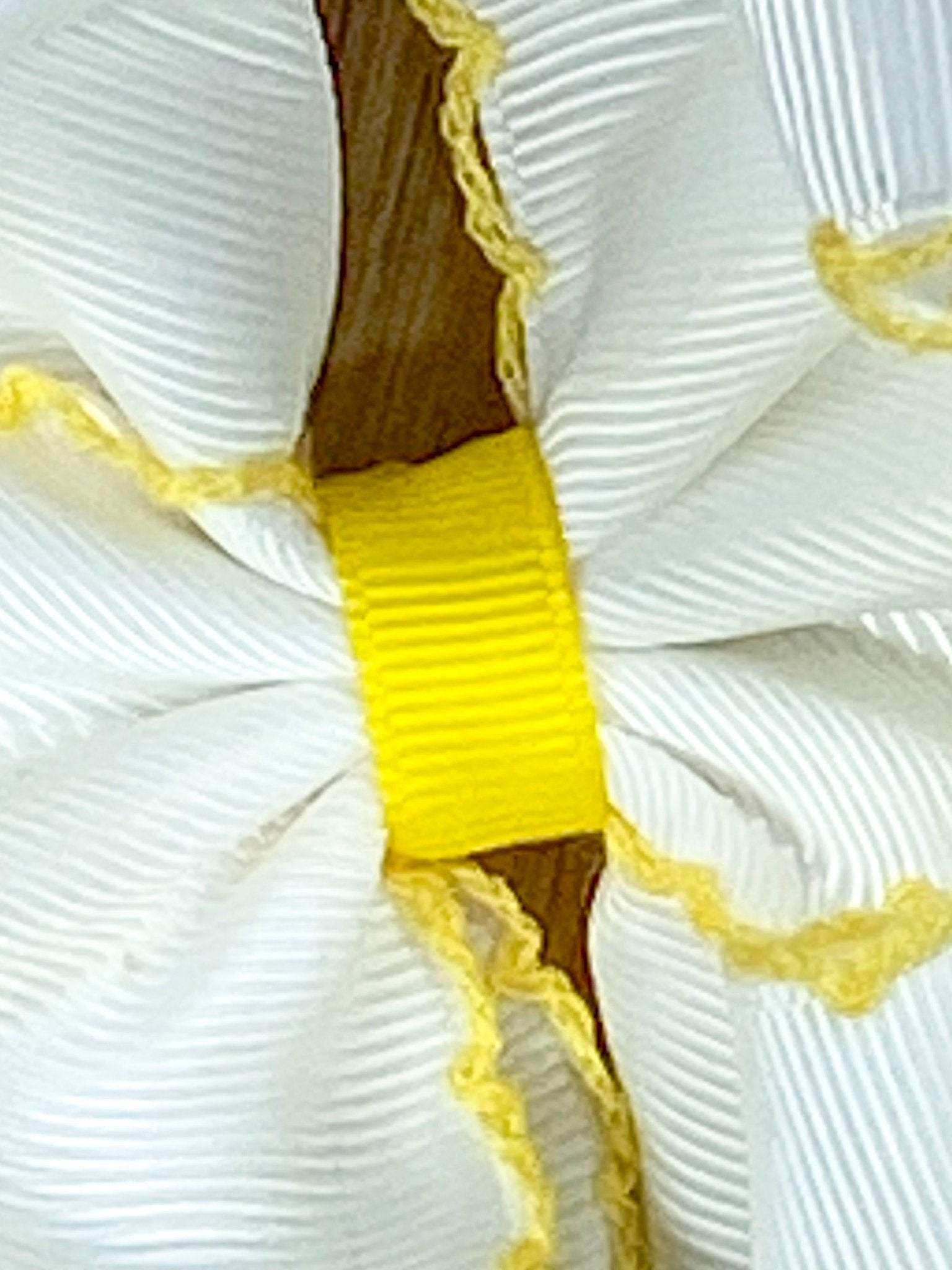 Close up of bow center on Pencil Embroidered Moonstitch Headband