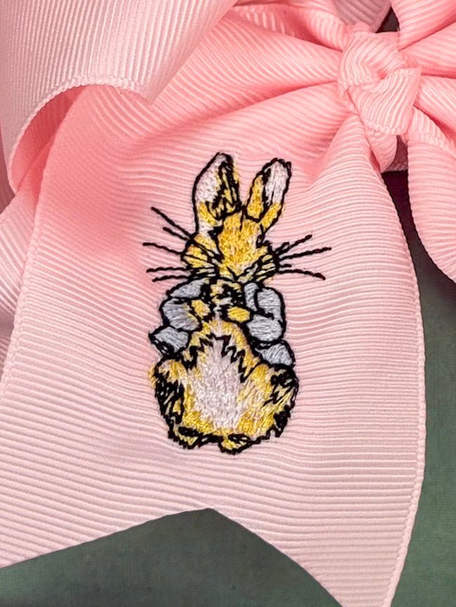 Close view of bunny embroidery on ribbon