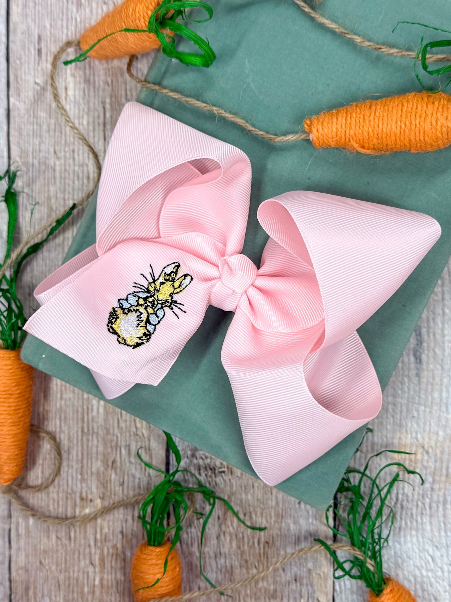 Peter Cottontail embroidered light pink hair bow made from grosgrain ribbon with bunny embroidery