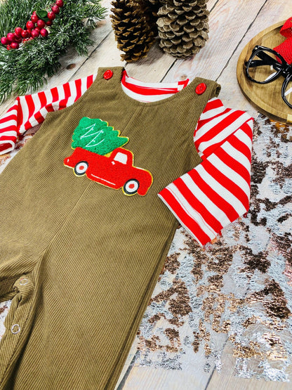 Side view of infant Christmas overalls showing embroidered truck detail and coordinating striped undershirt.