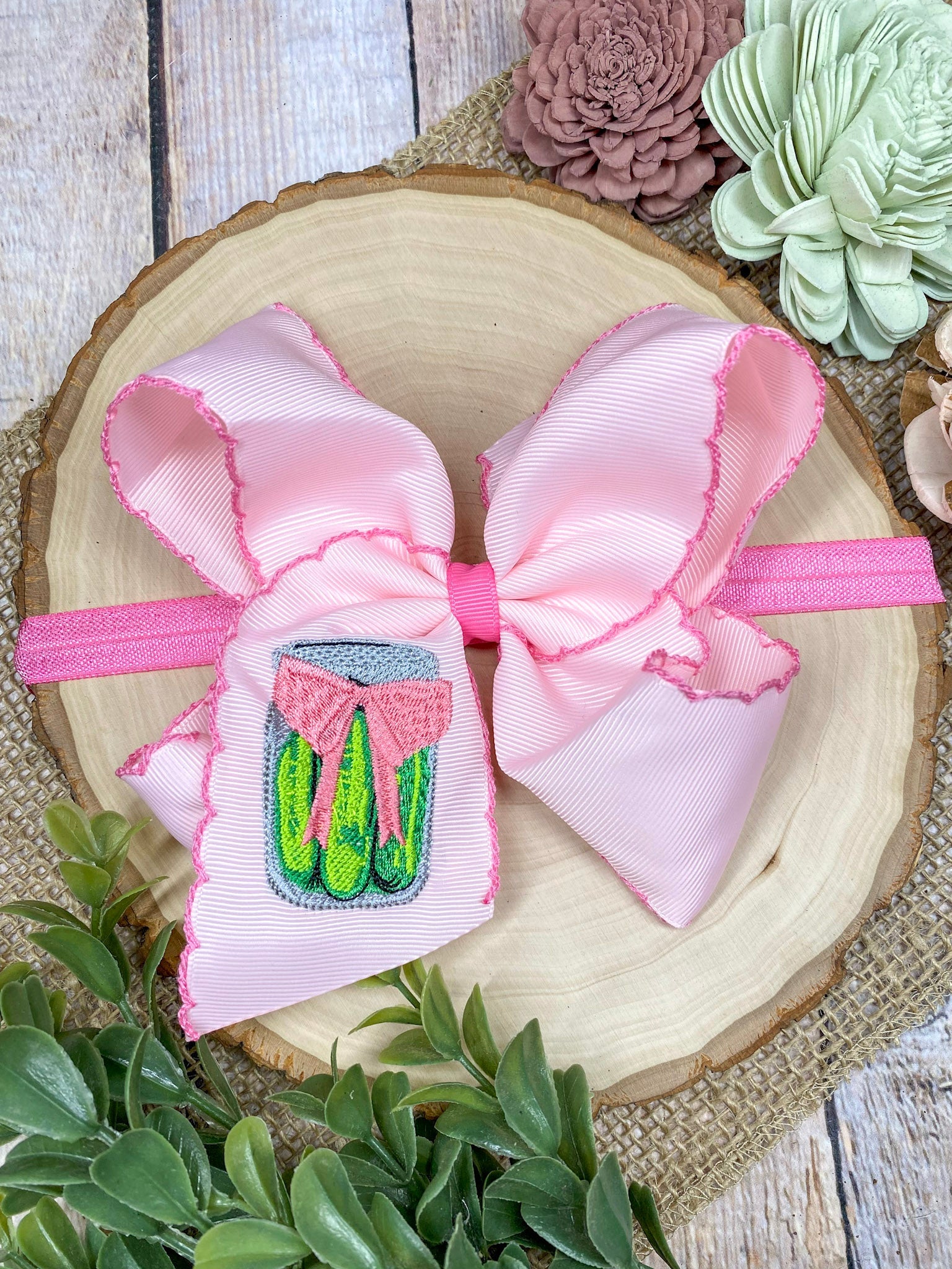 Pink Pickle Jar Moonstitch Headband on a wooden background