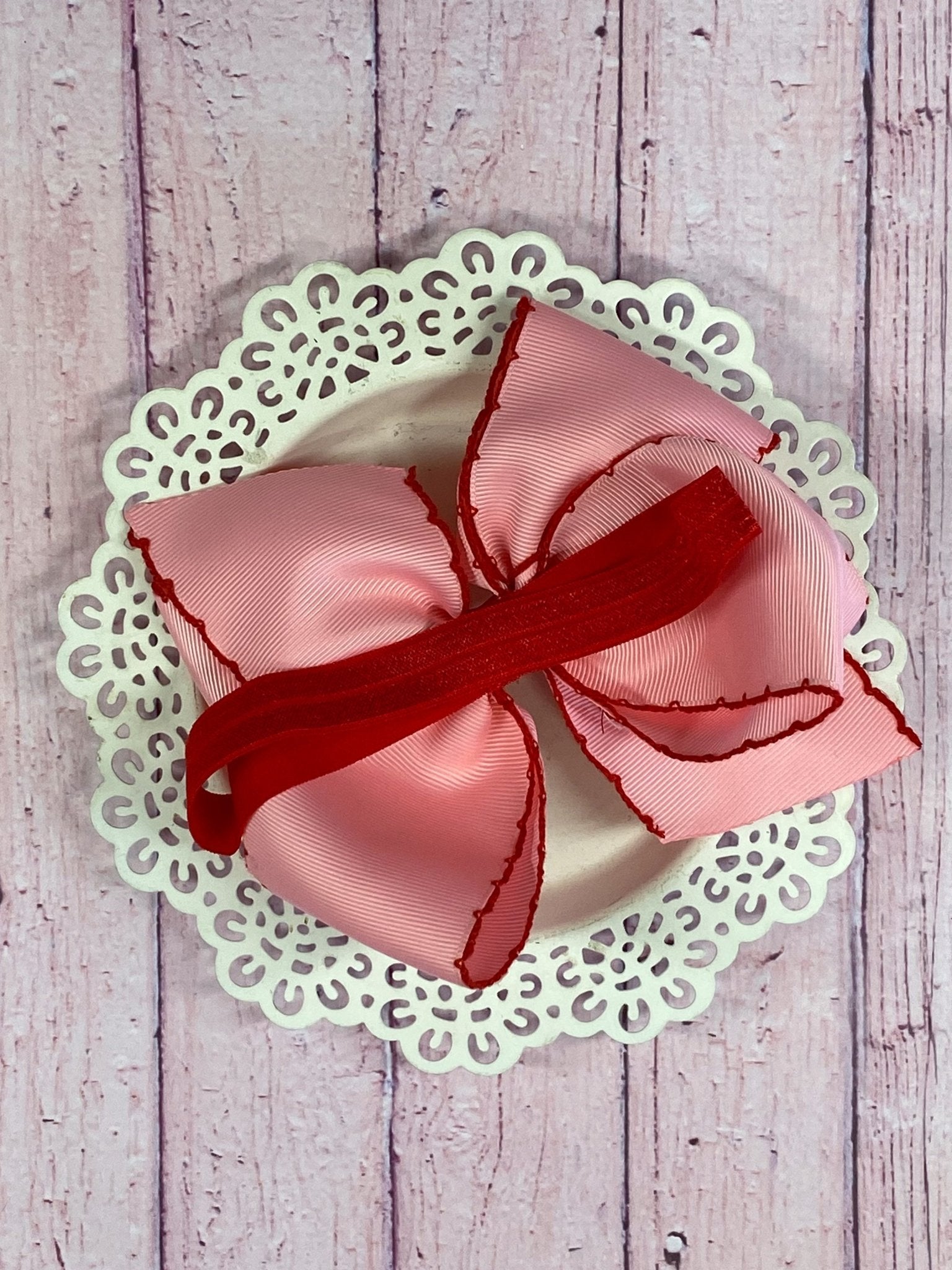 Back of Pink Apple Moonstitch Bow Headband showing satin elastic band