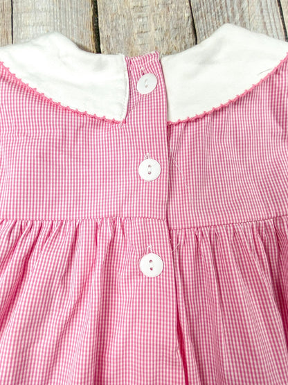 back of the dress showing 3 buttons starting from the collar and coming down