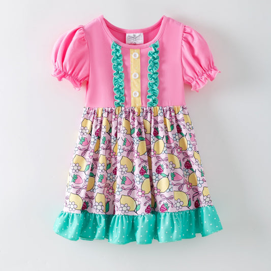 lemon and bows children's dress on a white background