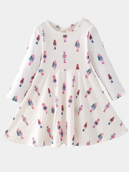 Pink Nutcracker Christmas twirl dress featuring a pastel nutcracker print, long sleeves, and a full twirl skirt for girls.